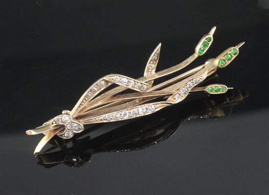 A yellow metal, diamond and gem set bullrushes brooch, 52mm.
